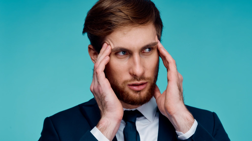 Man rubbing his temples